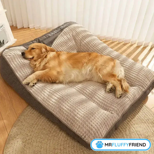 A golden retriever sleeping on a plush calming dog cushion in a cozy indoor space with soft lighting
